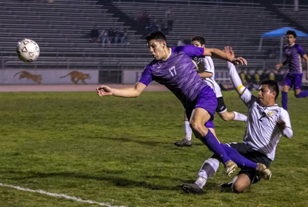 Lemoore's Diego Nunez keeps his eye on the ball during Friday night's key game against WYL leader Golden West.